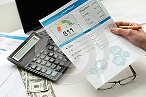 Credit report with score on a desk. High quality photo