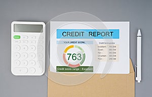 The Credit score report and calculator with computer keyboard on the desk