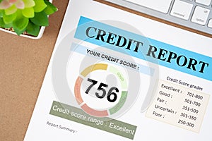 The Credit score report and calculator with computer keyboard on the desk