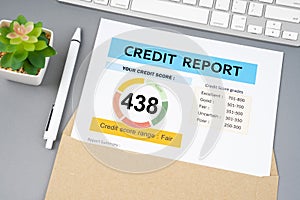 The Credit score report document and pen with computer keyboard on the desk