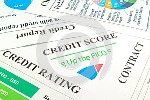 Credit score, report, rating and contract on the table.