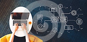 Credit score theme with person using a laptop