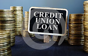 Credit union loan sign on wooden plate and money