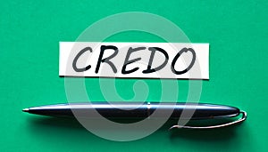 CREDO - word on a green background with a black handle photo