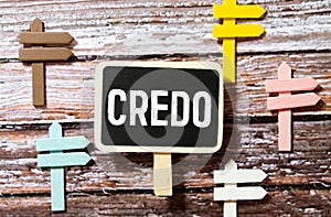 CREDO - word on a green background with a black handle. Info concept