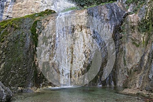Creek and huge waterfall in mountain at Tolmin in Slovenia