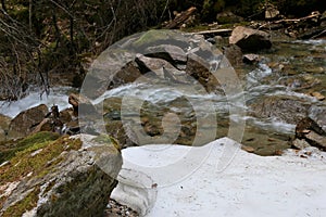 Creek with ice at Lower Reid Falls in Skagway, Alaska