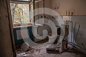 Creepy, abandoned room with window in building located in the Chernobyl ghost town