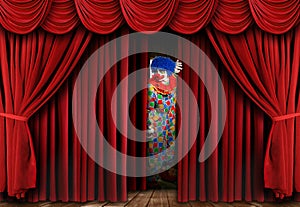 Creepy Clown Looking Through Stage Curtain Drapes