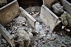 Creepy dolls on chairs in an abandoned building in Pripyat, Ukraine, Chernobyl exclusion zone