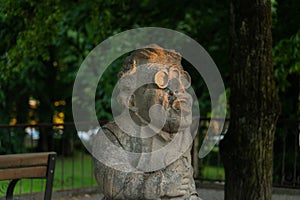 Creepy dwarf statue in Salzburg at sunset