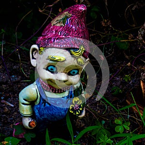 Creepy garden gnome with blonde hair and blue eyes