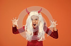 creepy girl wear devil horns having long white hair wig creating halloween mood, halloween all saints
