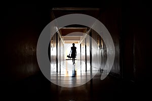 Creepy hallway with light. Gloomy tunnel. The Ghost of a little girl in the hallway of the house. The Ghost in the old house.