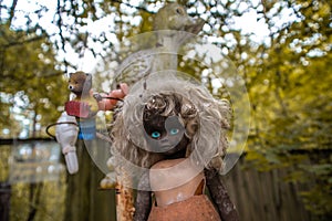 Creepy old doll at the backyard of the kindergarten at the abandoned village Kopachi near Chernobyl