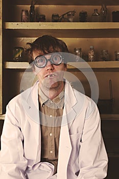 Creepy scientist weird portrait in his laboratory photo