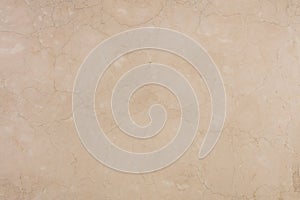 Crema Marfil marble background, natural texture for interior work. Slab photo.