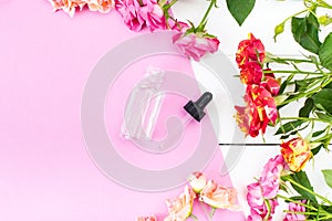 Crema Skincare Cosmetics Essence, Oil on a pink and white desk. Beauty background Mock up photo