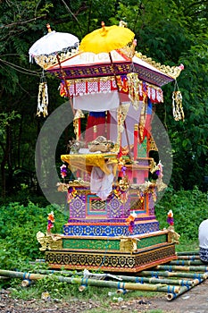 Cremation process, traditional decorated coffin with bright patterns