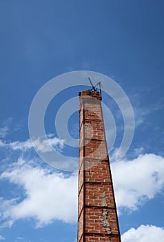 Crematorium smokestack in Thai temple, orange brick, sky background, selectable focus, funeral concept.