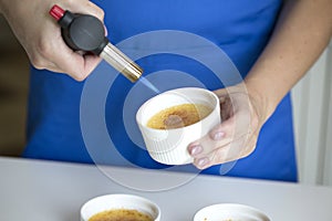 Creme Brulee Dessert Caramelizing Using a Torch