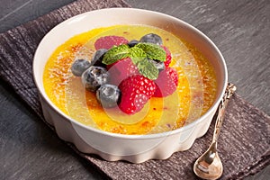 Creme brulee Dessert wih fruits and mint leaves