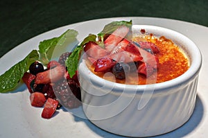 Creme Brulee with fresh fruit and mint sprigs 2 photo