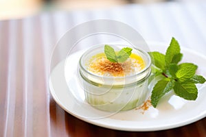 creme brulee with mint leaf garnish