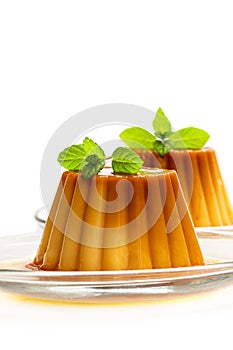 Creme caramel custard pudding isolated in white