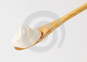 Creme fraiche on wooden spoon