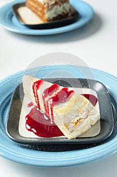 Crepe cake with strawberry sauce