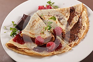 Crepe with chocolate spread and raspberry fruit