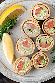 Crepe salmon rolls with cucumber and cream cheese
