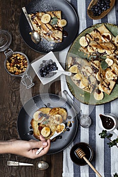 Crepes with banana, chocolate-nut sauce and sweet croutons