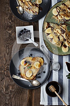 Crepes with banana, chocolate-nut sauce and sweet croutons