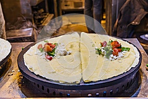 Crepes being made at a shop on El Moez street in Old Cairo photo