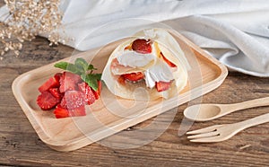 Crepes cake roll cream cheese with fresh strawberry.