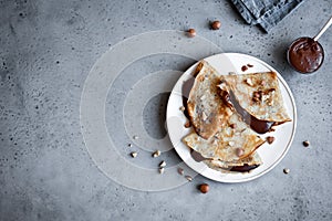 Crepes with chocolate and hazelnuts