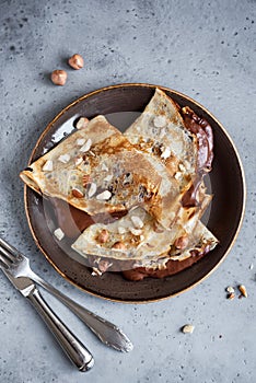 Crepes with chocolate and nuts