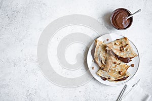 Crepes with chocolate and nuts