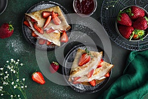 Crepes with cream cheese and fresh strawberry, top view