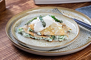 crepes with ham and asparagus sauce and cheese