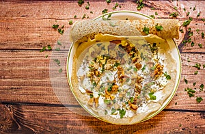 Crepes on plate with cream cheese, mushrooms, sauce and parsley/ homemade healthy vegetarian food