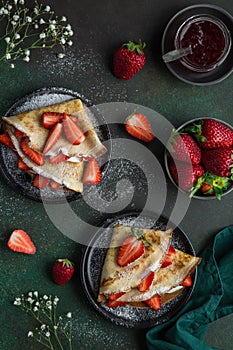 Crepes served with cream cheese and fresh strawberry,