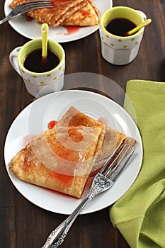 Crepes with strawberry sauce photo