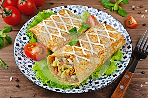 Crepes stuffed with stewed cabbage with carrots and eggs