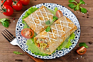 Crepes stuffed with stewed cabbage with carrots and eggs