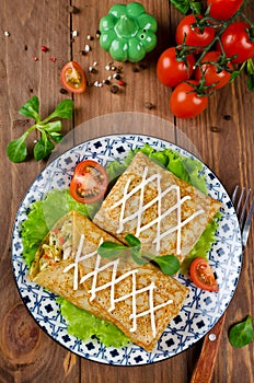 Crepes stuffed with stewed cabbage with carrots and eggs
