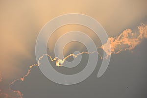 Crepuscular rays behind cloud at sunset