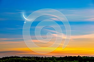 Crescent on the background of sunset, religion